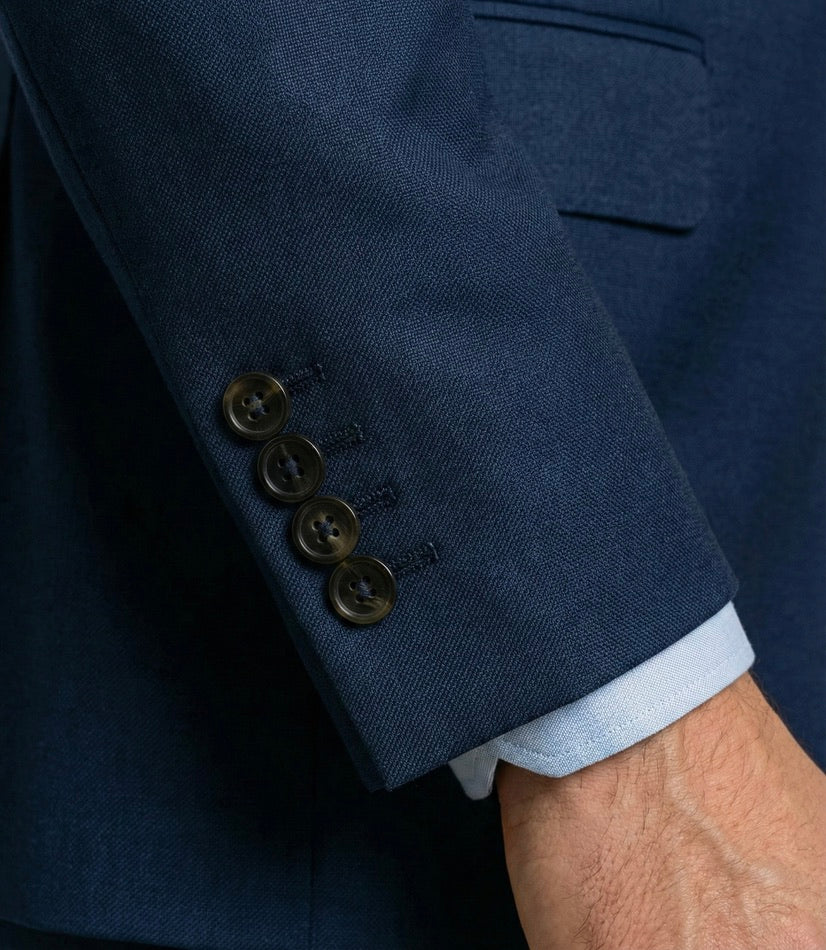 Zane Barläs functional horn buttons — navy suit jacket sleeve detail