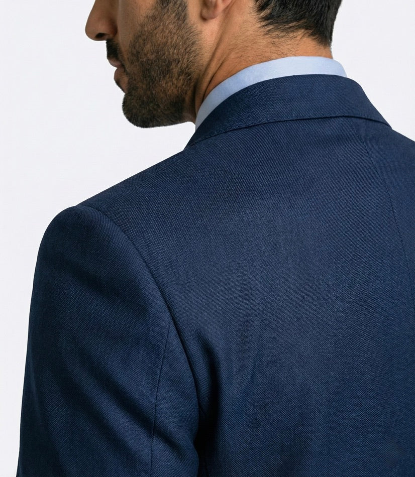 Zane Barläs natural shoulder construction — navy suit jacket shoulder detail