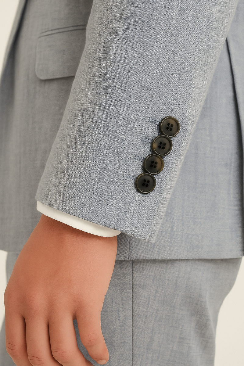 Close-up of horn buttons on grey linen double-breasted suit sleeve